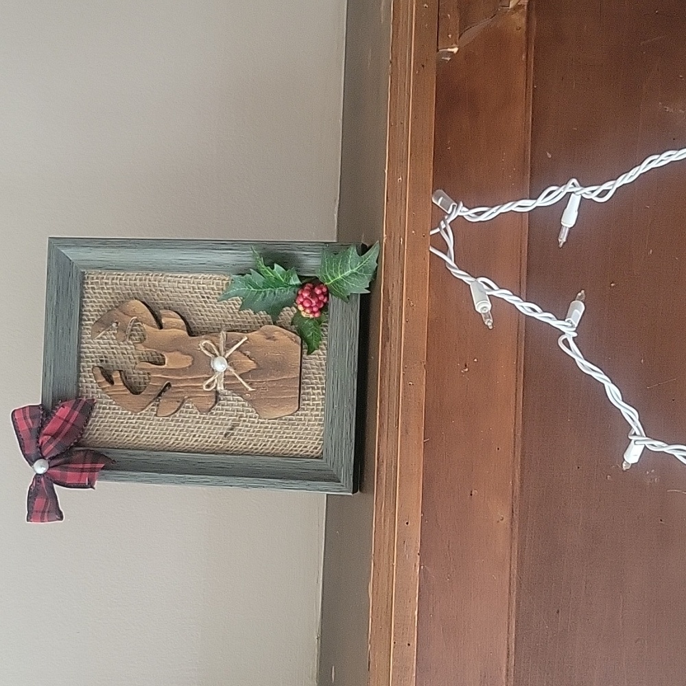 Handmade Chrismas deer picture.With red and black bow .